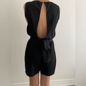Black short Jumpsuit. Loose fit. Great with heels or sneakers.